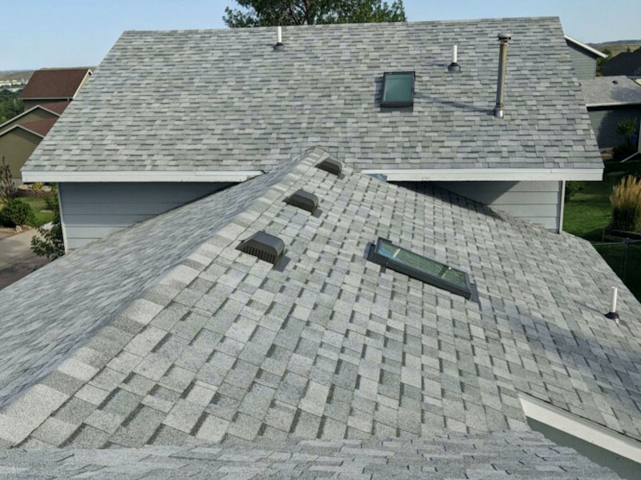 gray shingle residential roof repair in Rapid City, SD with repairs by Rypkema Renovations