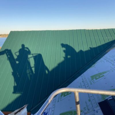 roofing contractor working on metal roof near Rapid City