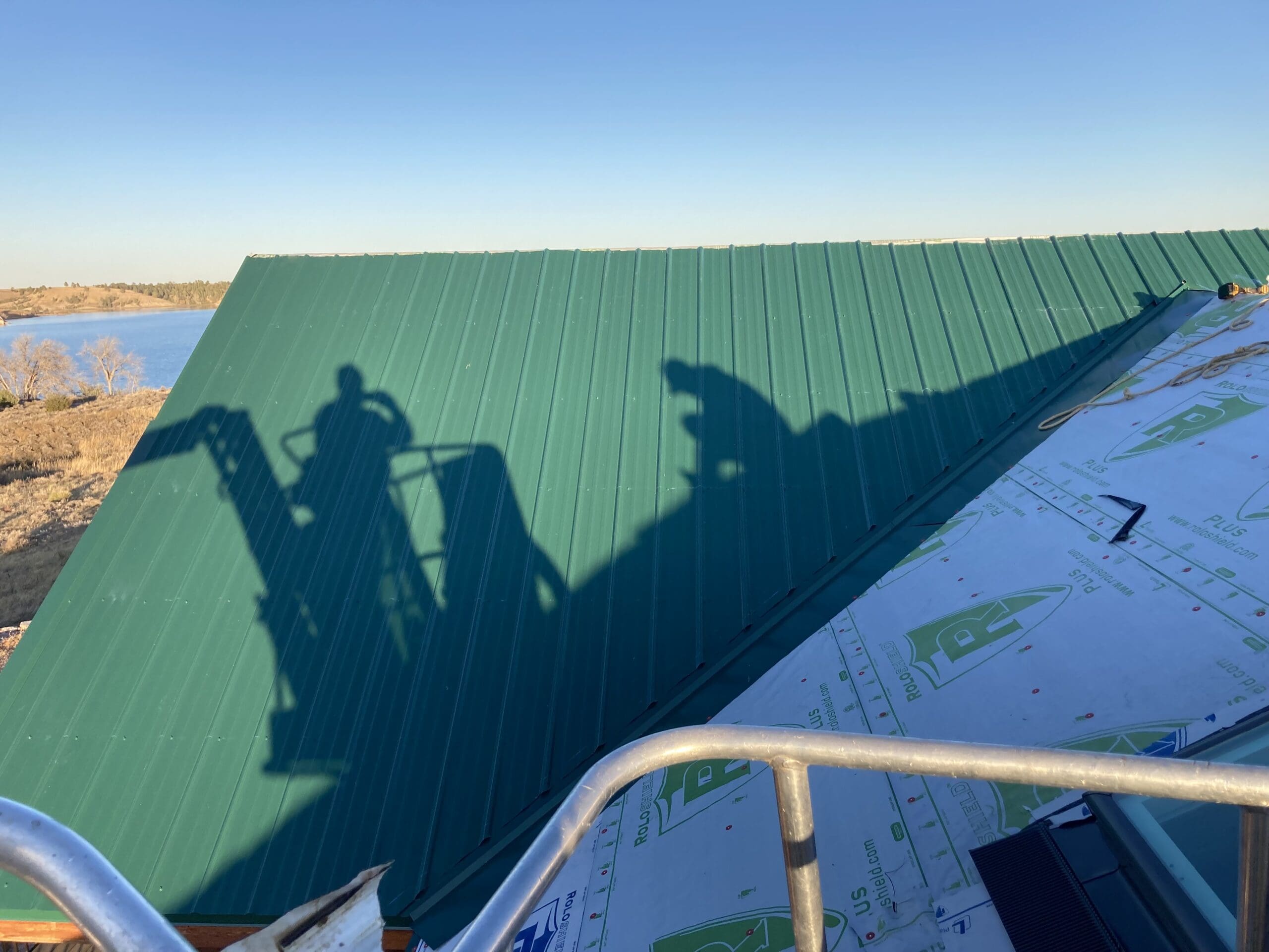 roofing contractor working on metal roof near Rapid City